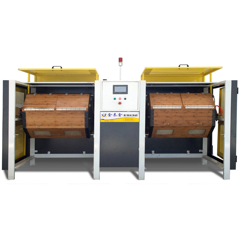 Twin wooden drum finishing machine with yellow protective covers and a central control cabinet.
