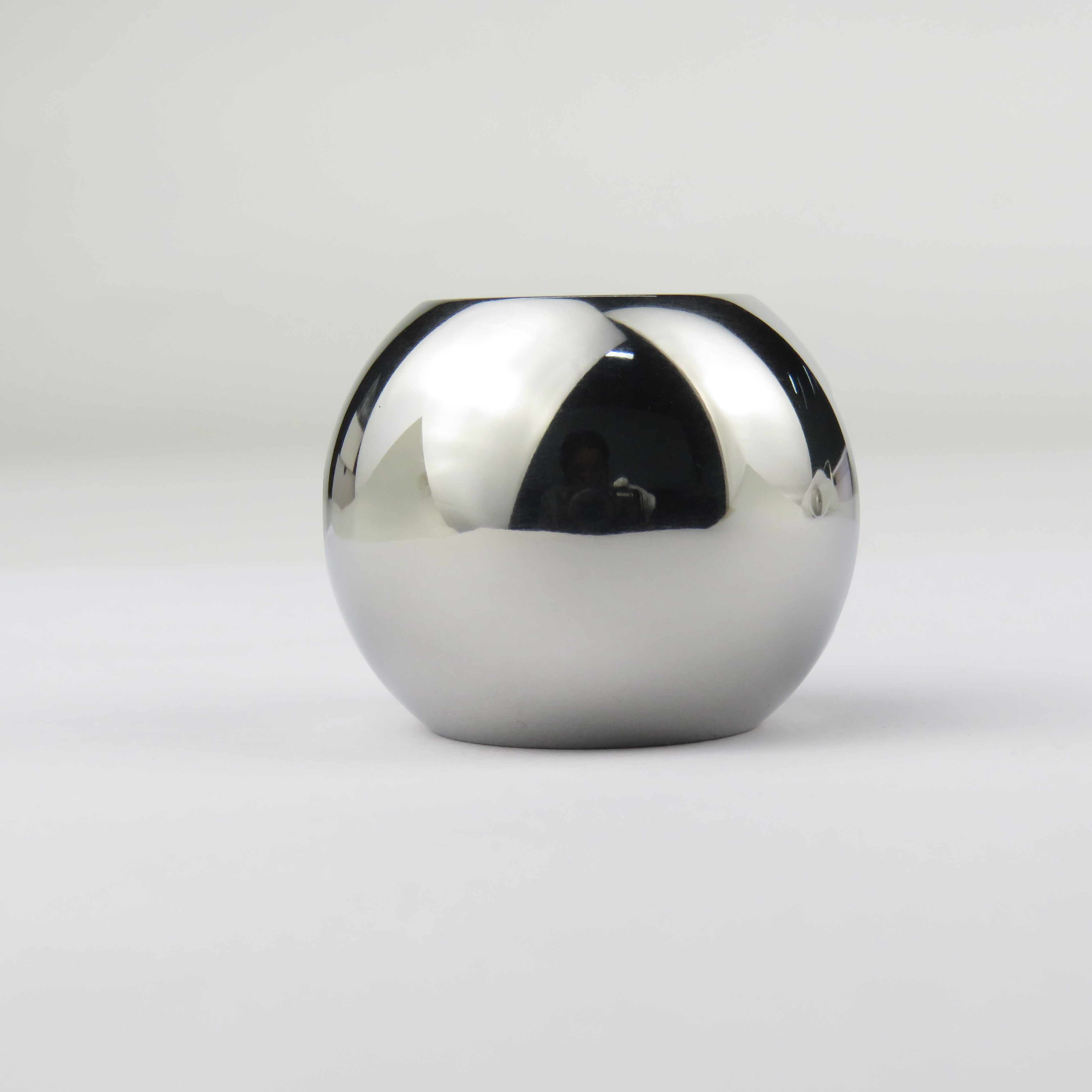 First-party SurfacePolish sample photograph: a stainless joint component after mechanical finishing.