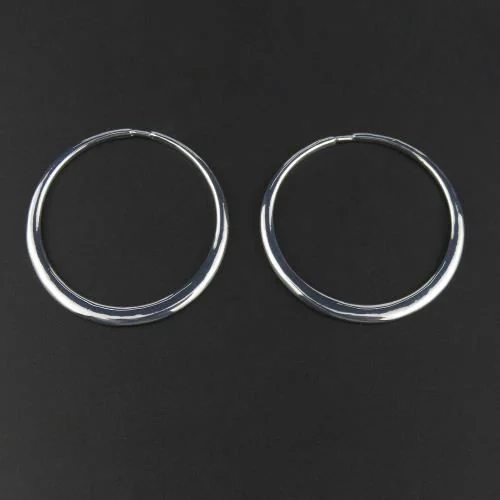 Timeless round hoop earrings with a sleek finish.