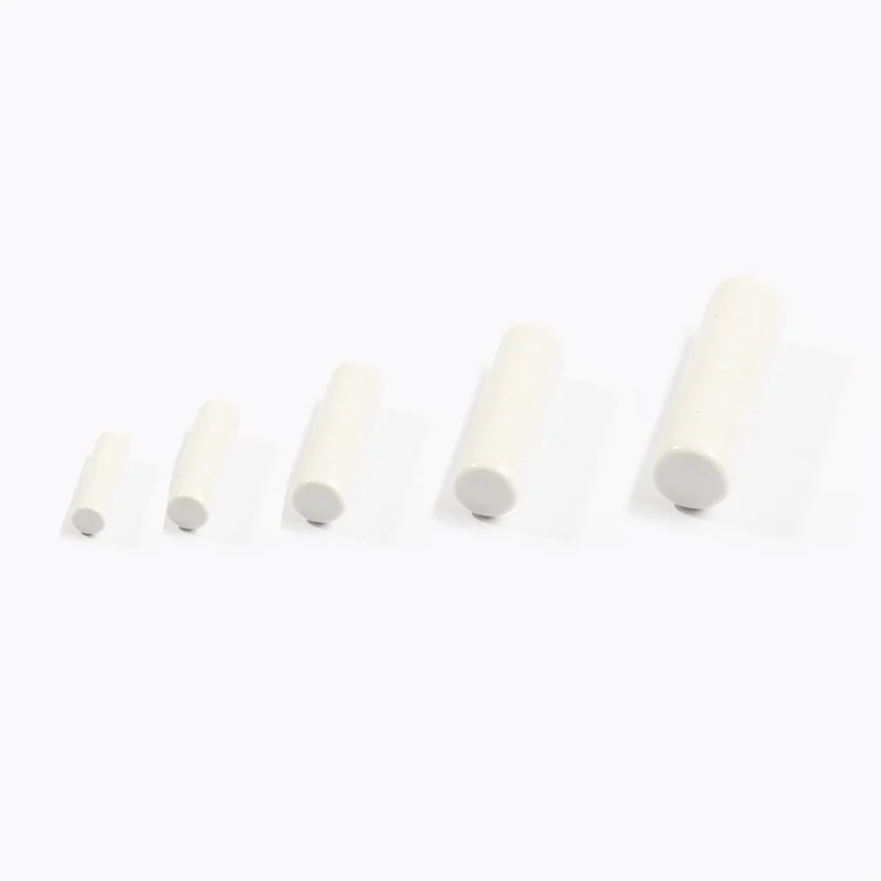 Ceramic components showing different surface finishes under magnification