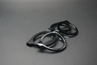 Black acetate eyeglass frames after controlled tumbling and polishing