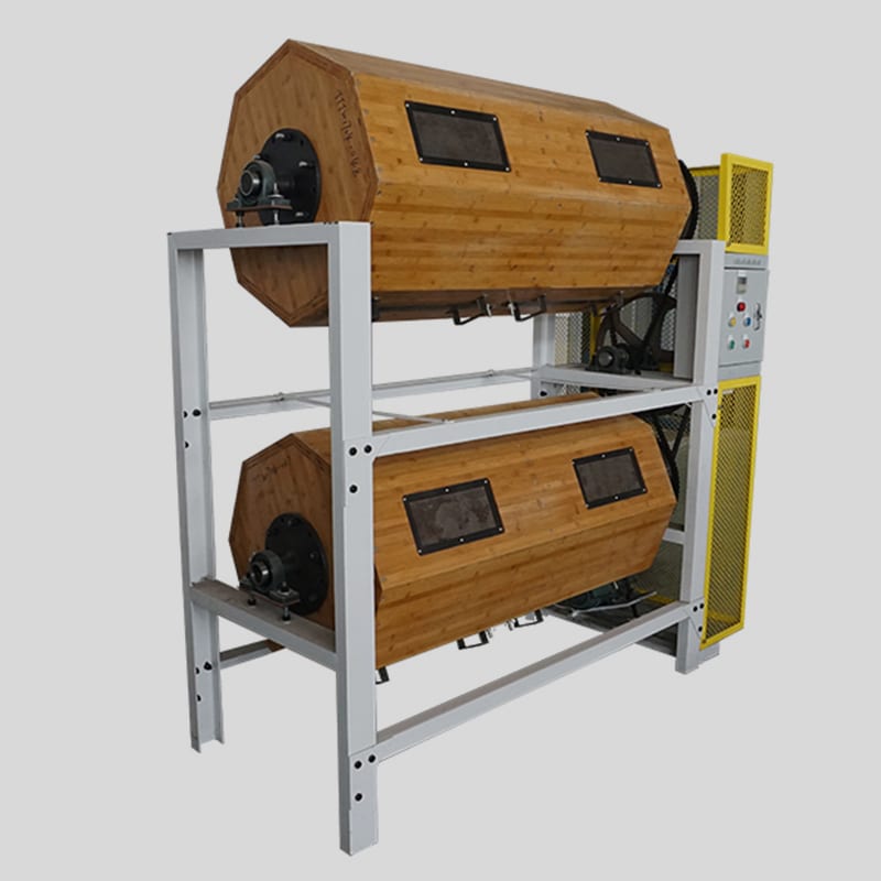 A barrel machine with the charge visible: the geometry that decides whether a long part bridges