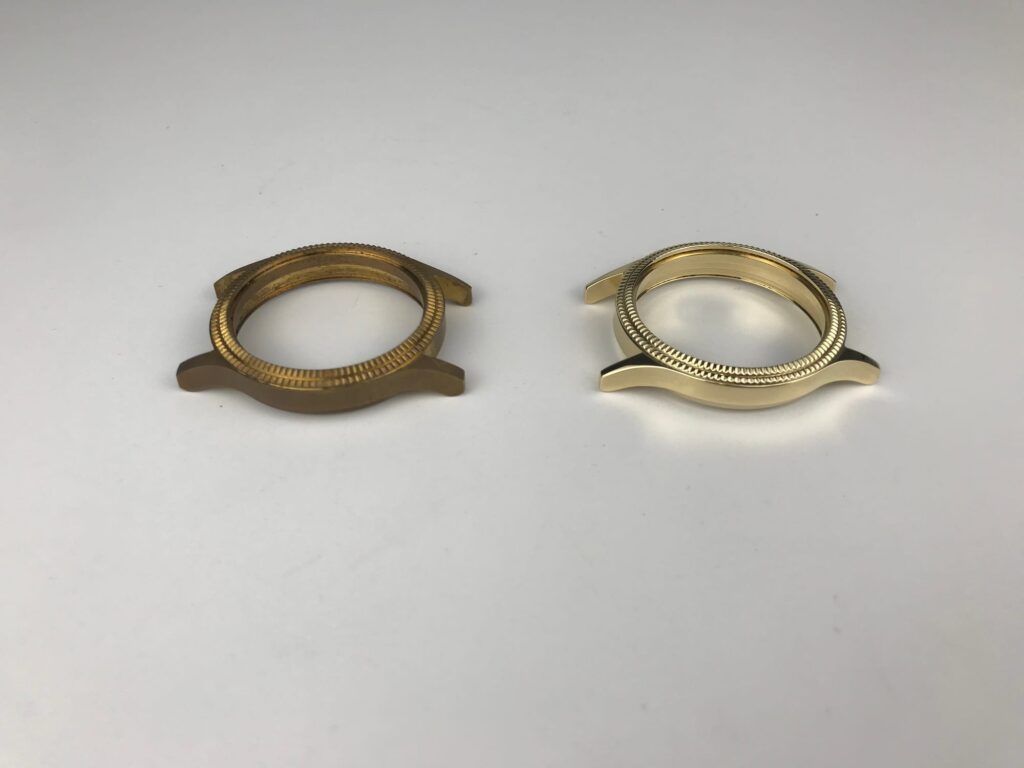 Two brass watch bezels side by side: the left one still dull yellow-brown, the right one bright gold after finishing
