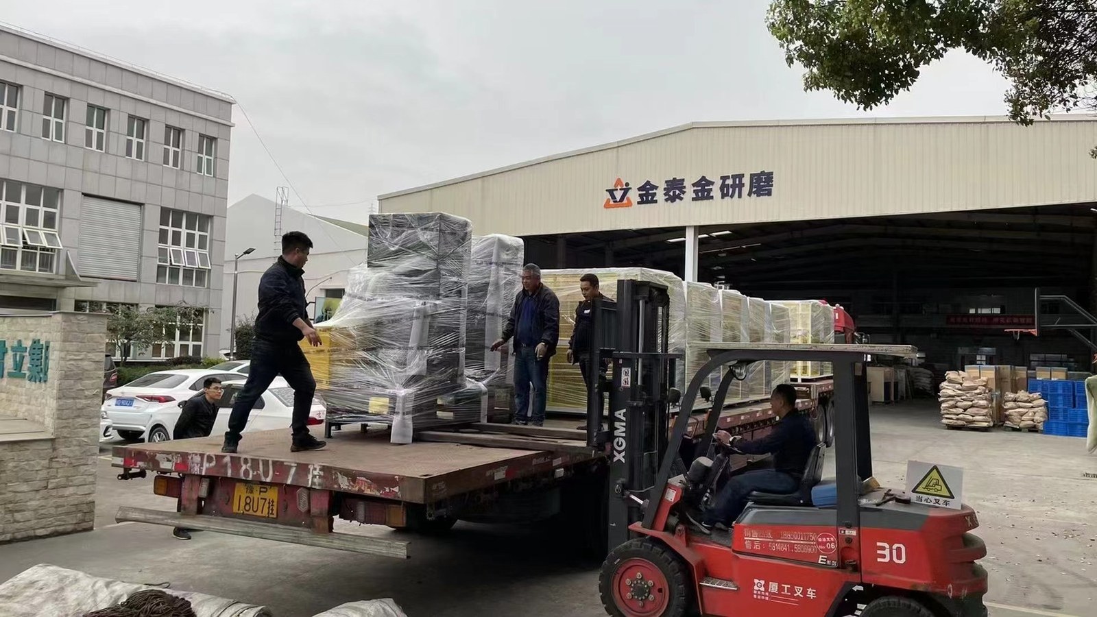 A forklift loading a container at the Jintaijin plant