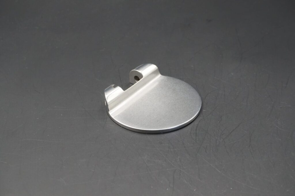 A hard-alloy part finished to a bright, even surface: the standard a pewter process is measured against, not a pewter part itself